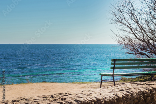 Bench on the coast sea.