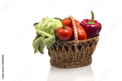 wicker basket full of fresh vegetables vine