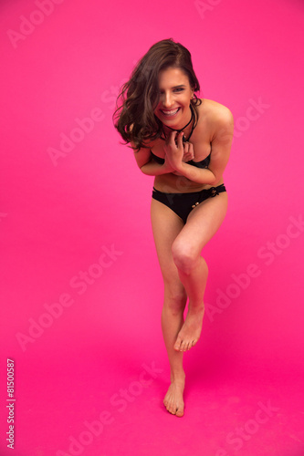 Young funny woman posing in bikini