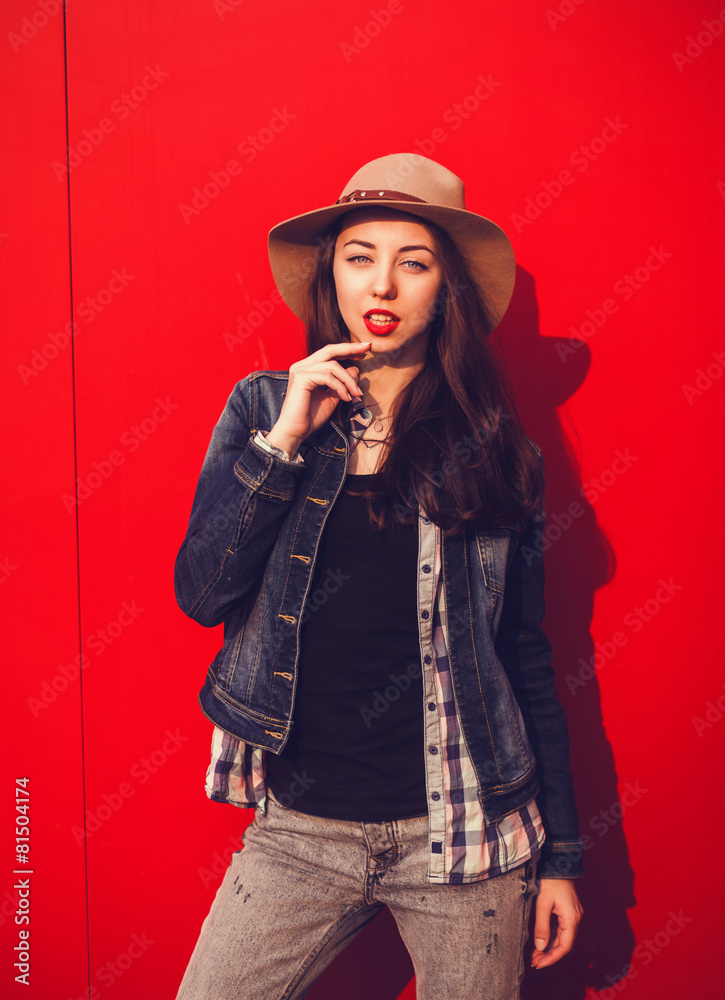 © jozzeppe777 - stylish young woman posing on a background © jozzeppe777 - stylish young woman posing on a background