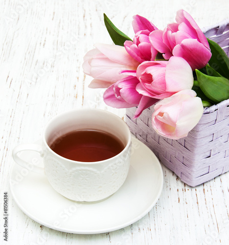 Cup of tea and pink tulips