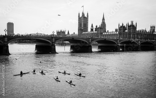 Canoes by river Thames at Westminster Bridge, in black and white #81507328