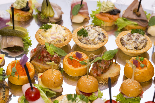 Canapes of cheese vegetables meat and seafood