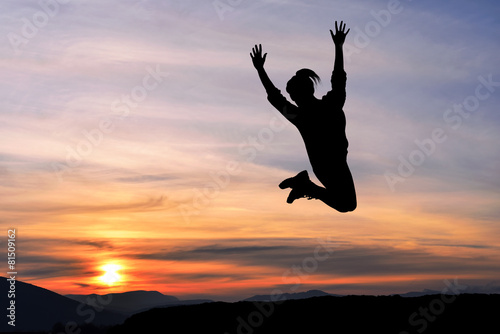 Happy girl woman jump against beautiful sunset. Freedom, enjoyment, landscape