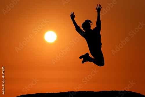 Happy girl woman jump against beautiful sunset. Freedom, enjoyment, landscape