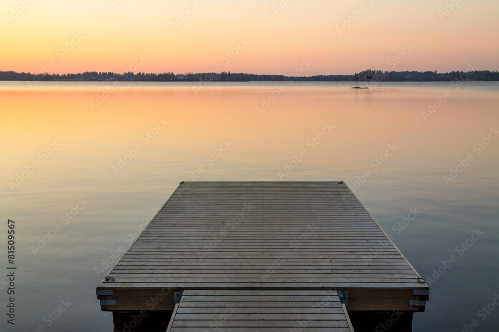 Fototapeta premium Wooden pier in the Scandinavian evening lake