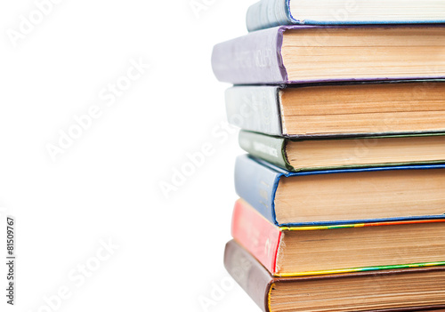 Stack of old books isolated on white