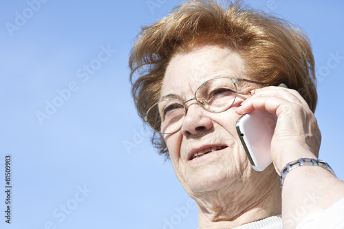 woman with mobile phone outdoors