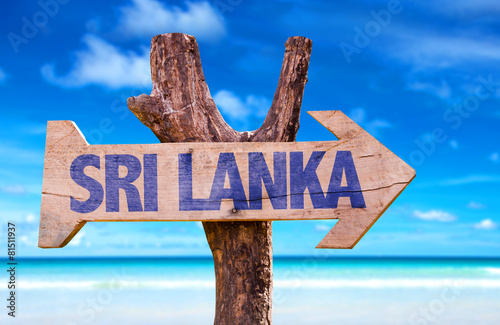 Sri Lanka wooden sign with beach background photo