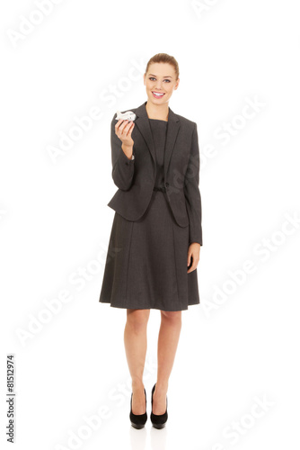 Business woman holding airplane model.