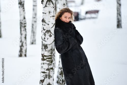 Canvas Print beautiful blonde woman walking outdoors in winter frost