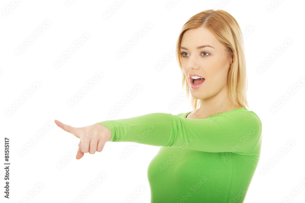 Shocked woman pointing aside. Shocked woman pointing aside.
