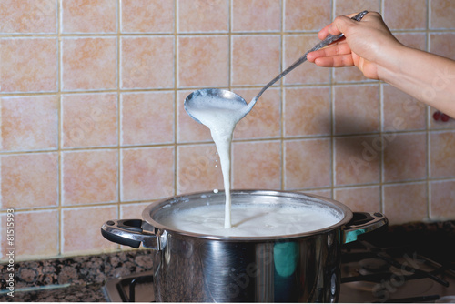 pot boiling fresh milk for consumption