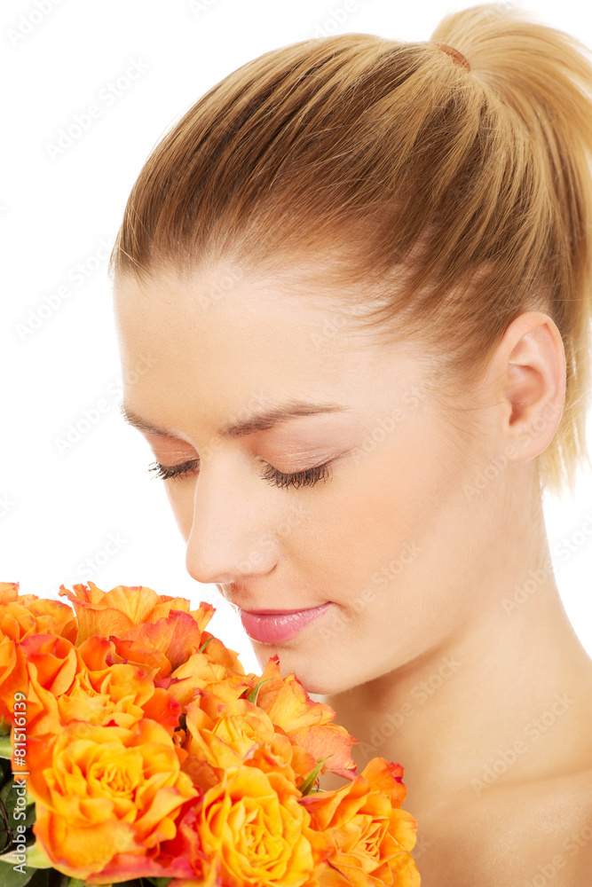 Fototapeta premium Smiling woman with fresh roses.