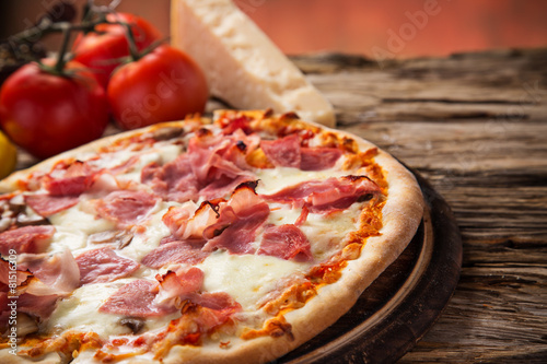 Delicious italian pizza served on wooden table