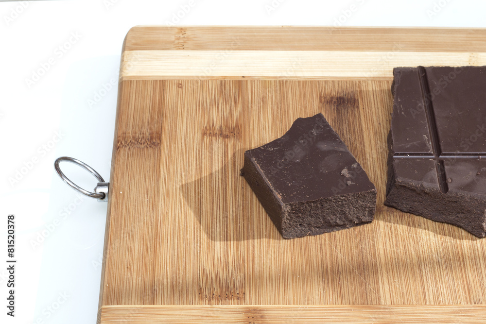 Fototapeta premium Tile brown milk chocolate on a cutting board
