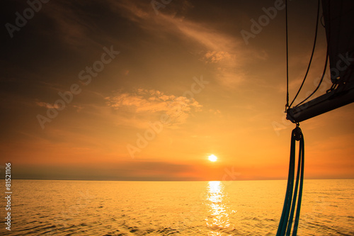 Yachting yacht sailboat in baltic sea at sunset sunrise.