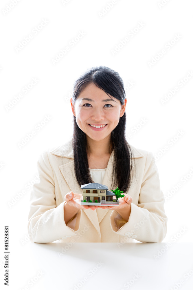 asian businesswoman with miniature house asian businesswoman with miniature house