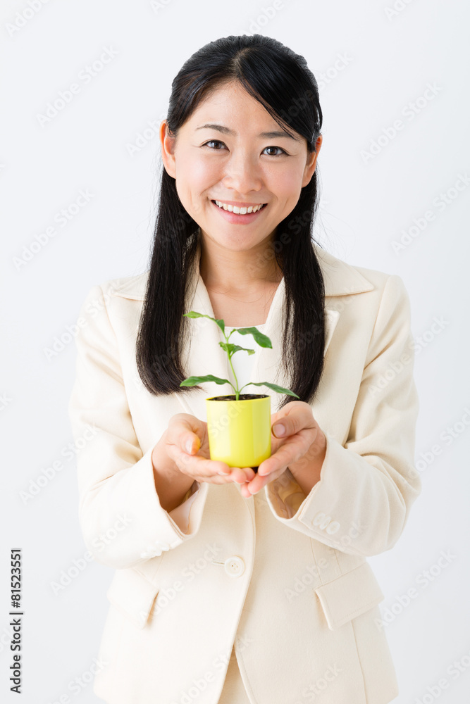 asian businesswoman with green plant asian businesswoman with green plant