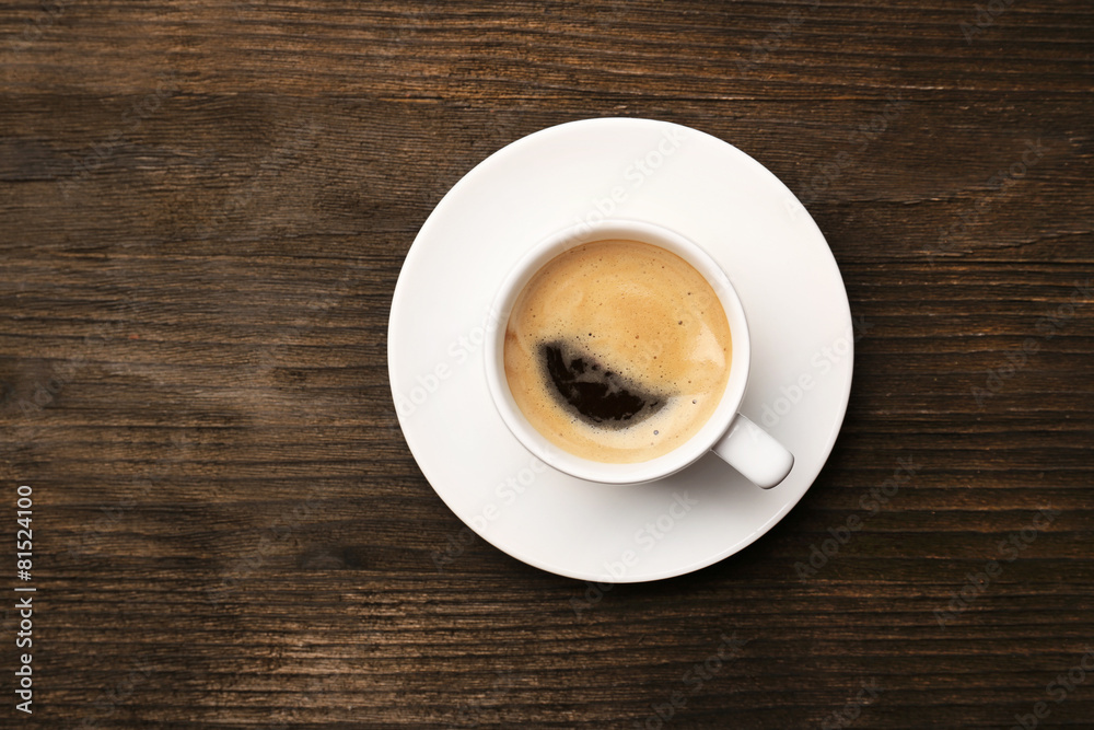 Cup of coffee on wooden table, top view Cup of coffee on wooden table, top view