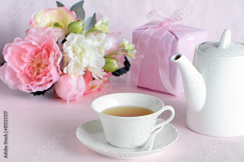 Lovely flowers with gift and cup of tea © fotogal