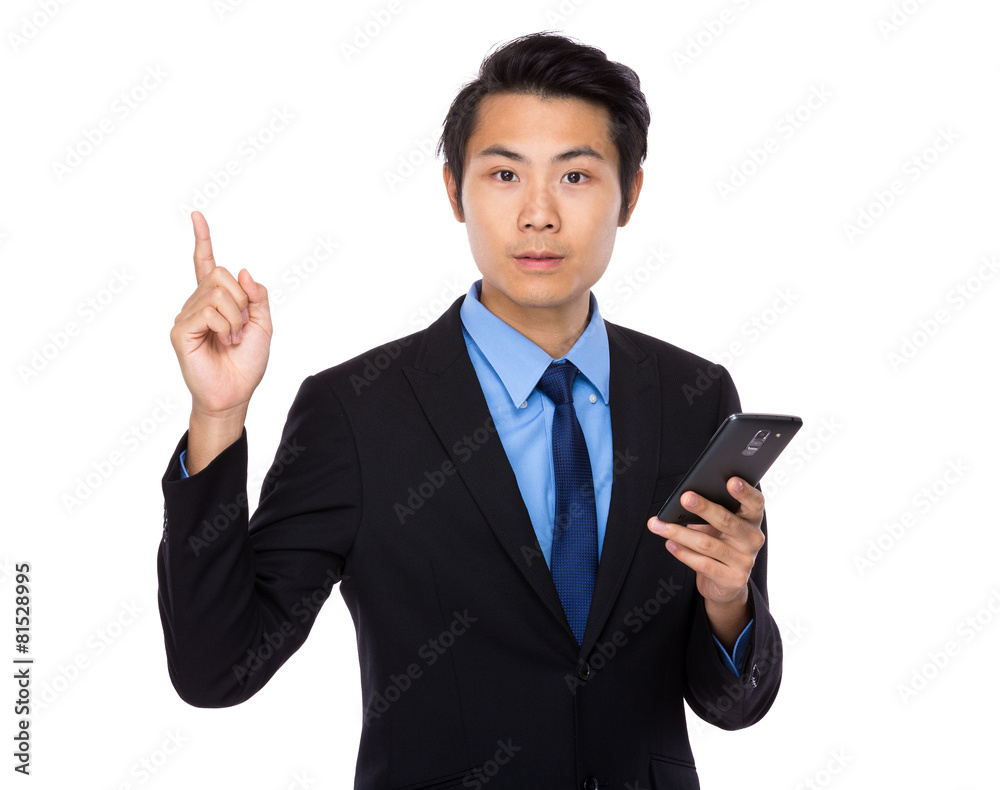 Asian business man with cellphone and finger up Asian business man with cellphone and finger up