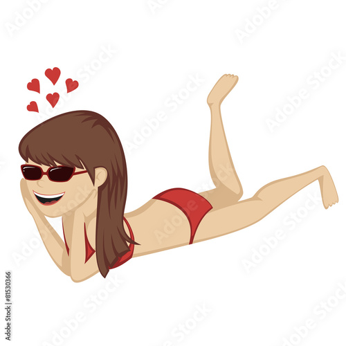 Lying on the beach - A cute brunette is on the beach.