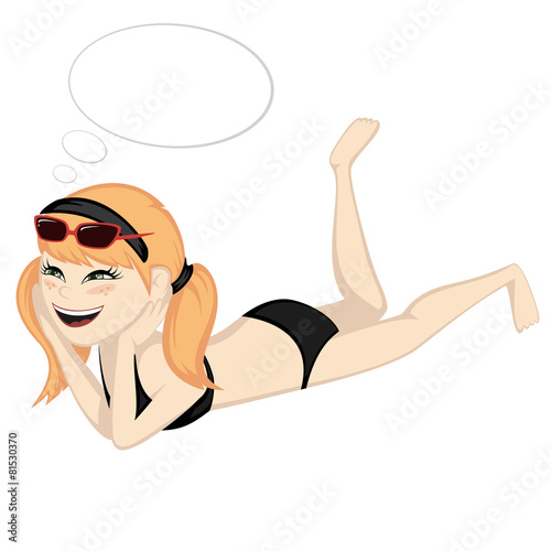 Lying on the beach - A cute ginger girl is sunbathing.