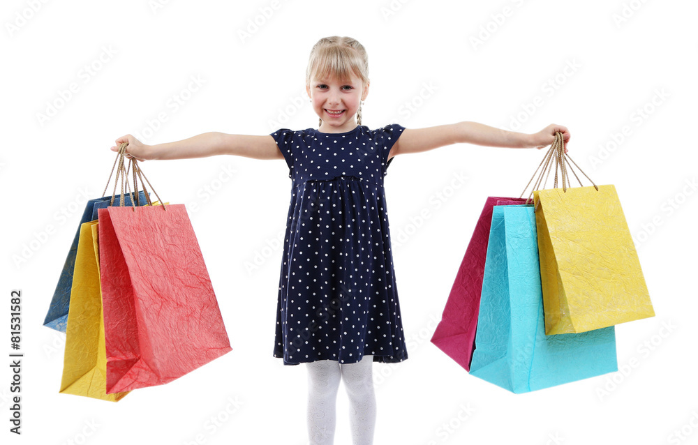 Beautiful little girl with shopping bags isolated on white Beautiful little girl with shopping bags isolated on white
