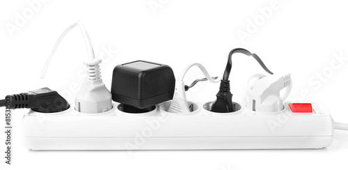 Many plugs plugged in extension cord isolated on white photo