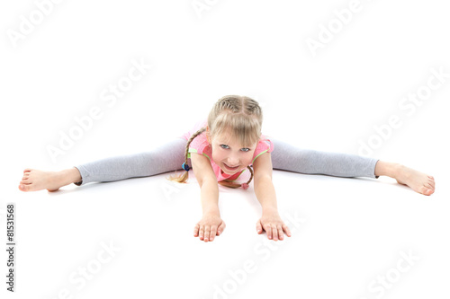 Fototapeta Naklejka Na Ścianę i Meble -  Little girl doing exercises isolated on white