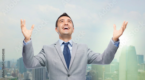 happy laughing businessman in suit