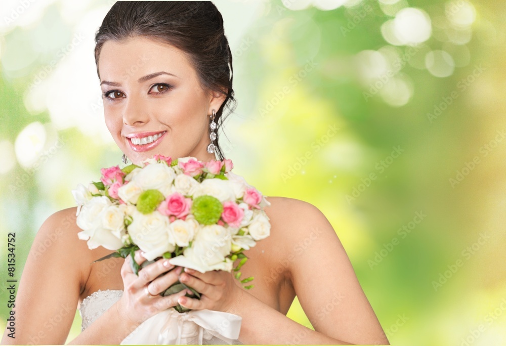 Bride. Young attractive bride with the bouquet of white roses