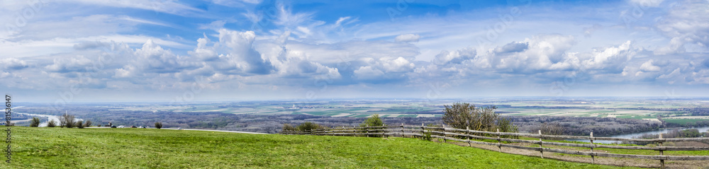 panoramatic view of austrian landscape with Danube river and beautiful sky with many clouds in the background