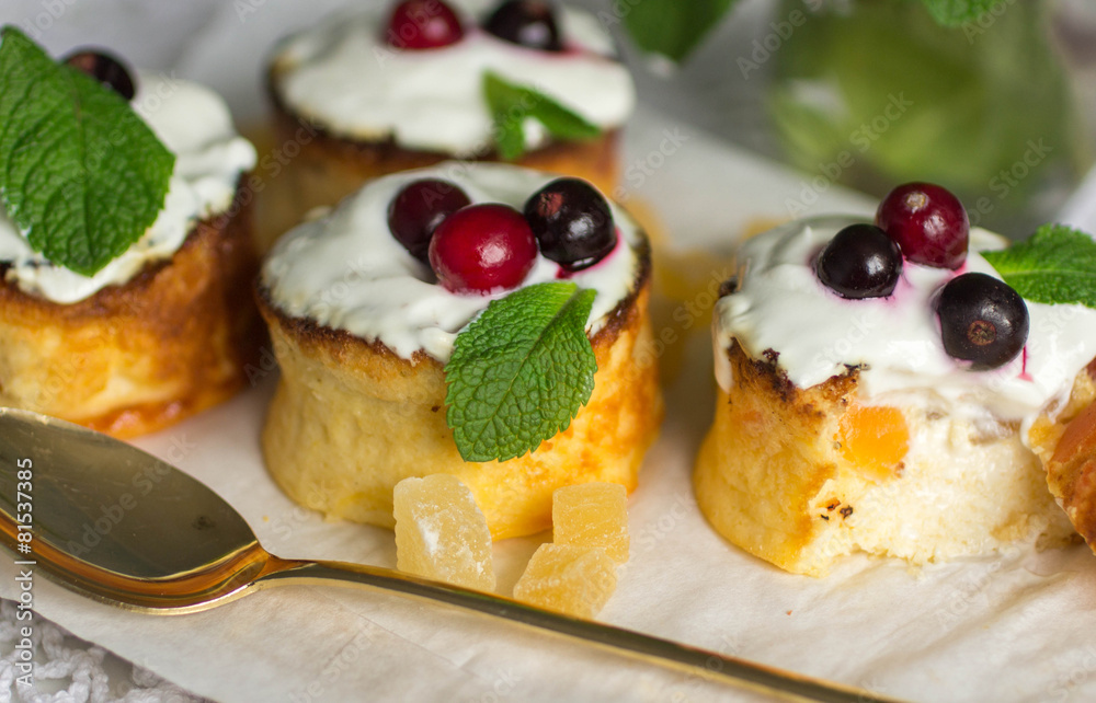 Curd pudding with candied fruit and fresh berries. Soft focus Curd pudding with candied fruit and fresh berries. Soft focus