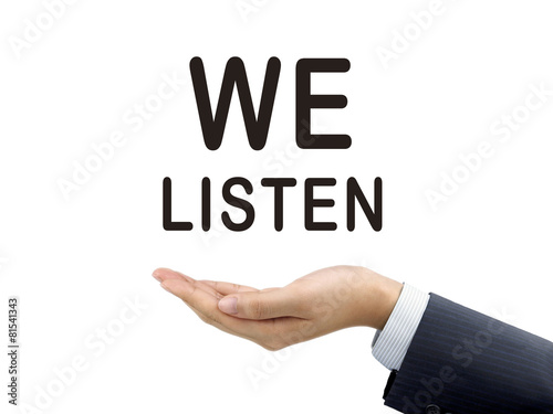 we listen words holding by businessman's hand