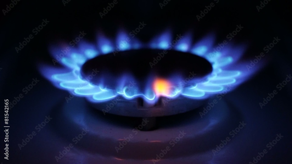 Natural gas inflammation in stove burner, close up view Natural gas inflammation in stove burner, close up view