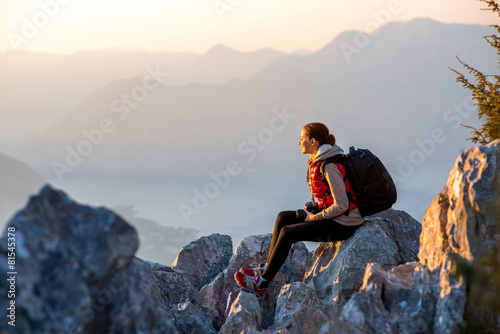 Young photographer on the top of mountain