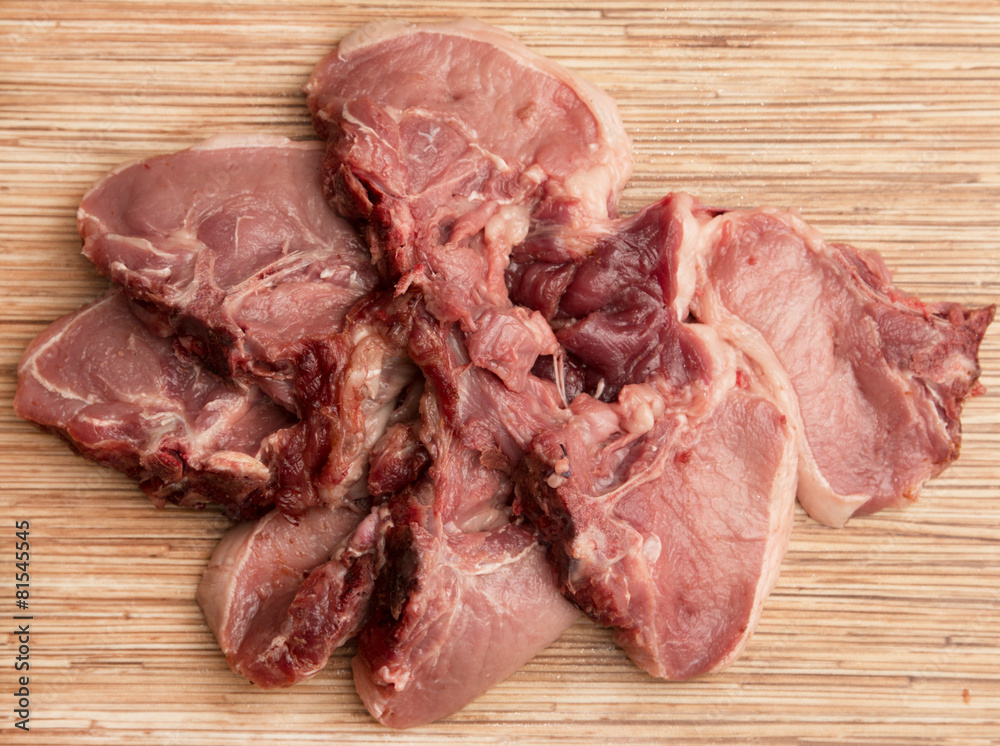 Fresh meat on a wooden background