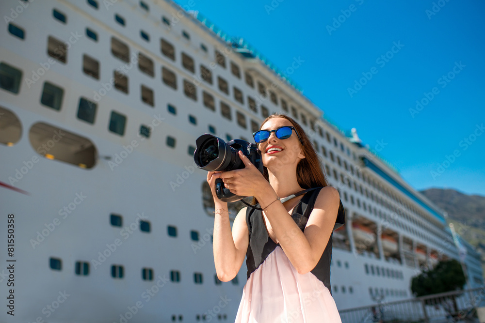 Woman tourist near the big cruise liner