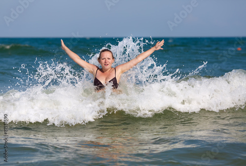 Girl in sea wave