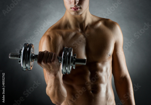 young man with dumbbell