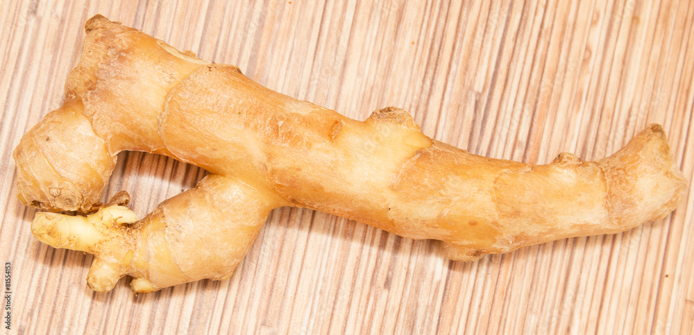 ginger root on a wooden background ginger root on a wooden background