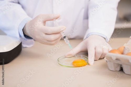 Food scientist examining egg yolk © WavebreakMediaMicro