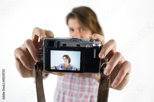 Casual brunette taking a selfie