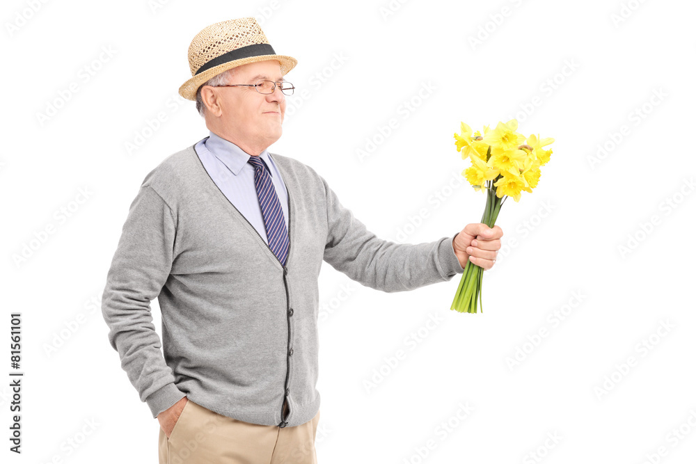 Senior gentleman holding a bunch of tulips Senior gentleman holding a bunch of tulips