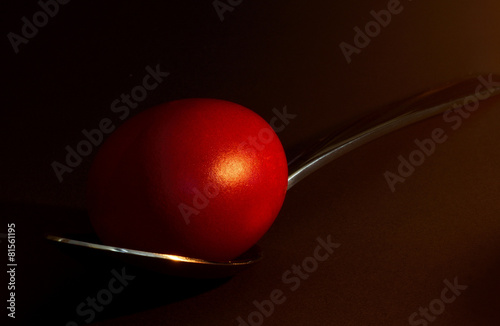 Easter red egg, on spoon