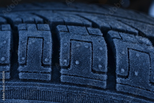 The tire is covered with frost.