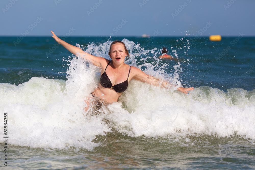 Woman and wave