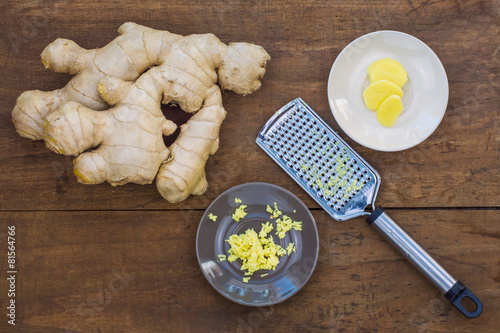 Different forms of ginger root, whole, grated and sliced.